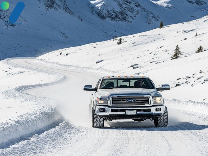 a-4x4-truck-demonstrates-safety-and-control-using-the-best-winter-tires-for-trucks-on-a-snowy-mountain-highway