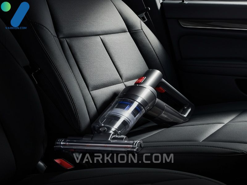 a-sleek-handheld-car-vacuum-rests-on-the-passenger-seat-of-a-pristine-sunlit-car-interior