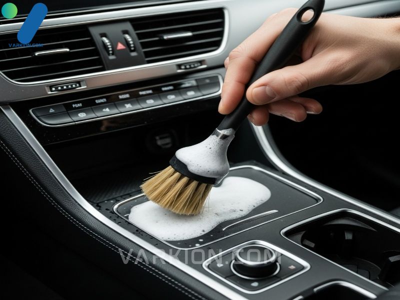 applying-car-detailing-cleaners-into-tight-crevices-during-a-deep-auto-interior-clean