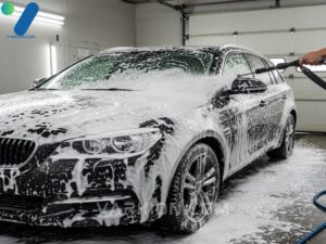 dark-car-covered-in-thick-white-snow-foam-applied-by-a-foam-cannon