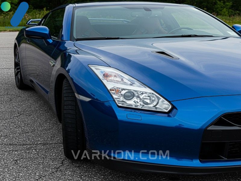 deep-blue-sports-car-freshly-waxed-perfectly-reflecting-the-sky