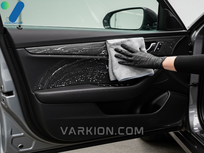demonstrating-the-professional-two-towel-method-using-interior-car-cleaning-products-on-a-door-panel
