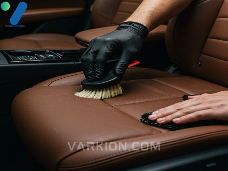 detailer-brushing-leather-cleaner-onto-a-luxury-car-seat
