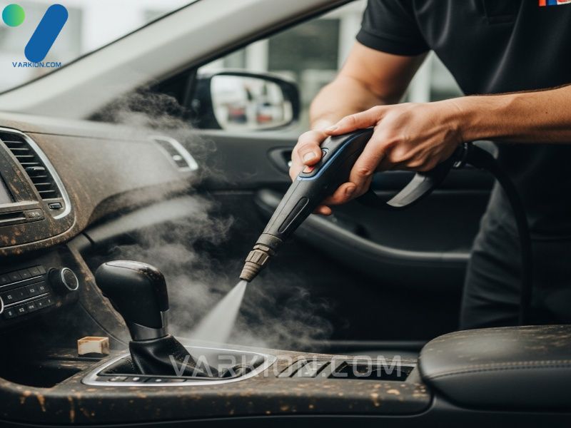 detailer-uses-a-handheld-steam-cleaner-on-a-heavily-soiled-car-interior-seat-or-dashboard