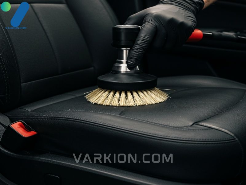 detailer-using-a-drill-brush-to-clean-car-seat-upholstery-with-interior-shampoo