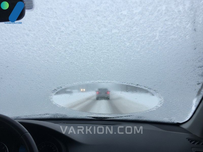 drivers-view-through-a-heavily-frosted-windshield-illustrating-the-safety-hazard-and-the-need-for-an-effective-car-defroster-system