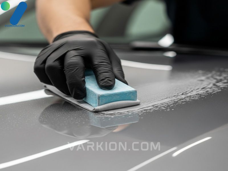 exterior-detailing-process-showing-the-use-of-a-clay-bar-to-remove-deep-contaminants-from-the-paint-crucial-for-finding-the-best-car-detail-close-to-me