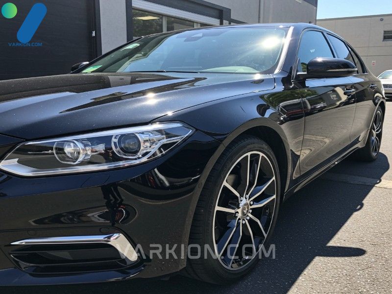 final-result-of-successful-automotive-paint-correction-using-a-professional-car-scratch-remover-showing-a-perfectly-glossy-scratch-free-car-surface