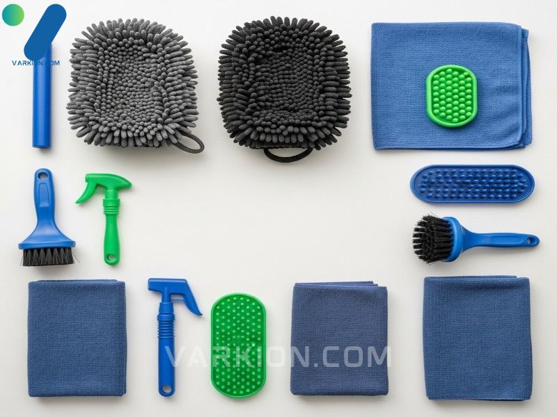 flat-lay-of-essential-car-cleaning-tools-wash-mitts-grit-guards-microfibre-towels-and-wheel-brushes