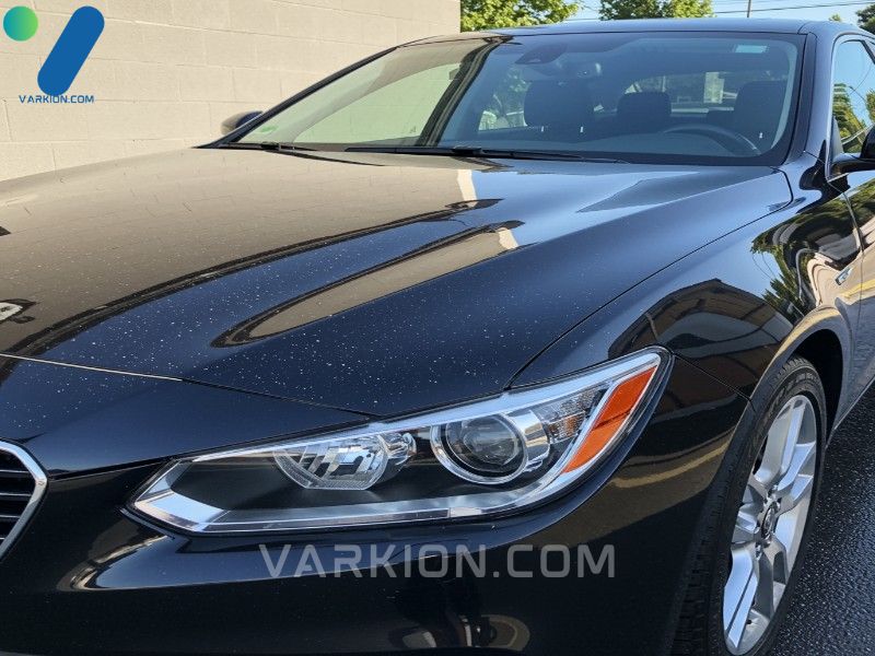 gleaming-car-with-a-streak-free-shine-and-crisp-reflection-parked-in-the-sun
