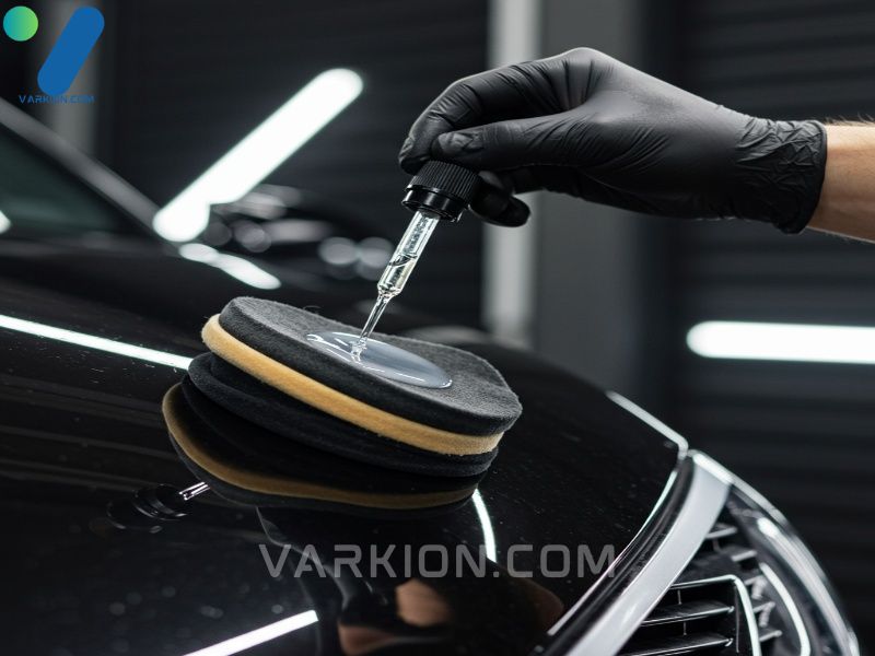 hand-applying-ceramic-coating-droplet-onto-a-microfiber-applicator