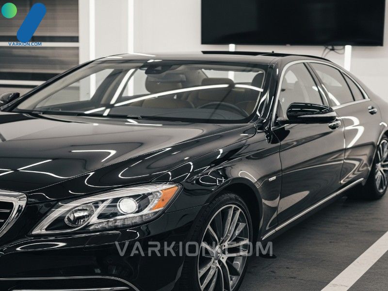 highly-detailed-glossy-dark-luxury-sedan-reflecting-light-showcasing-high-curb-appeal