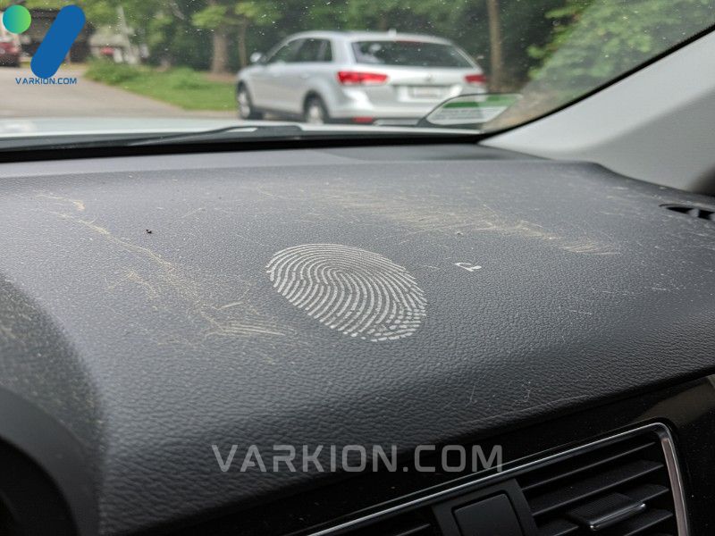 identifying-dust-and-grime-on-the-car-dashboard-before-starting-the-cleaning-process