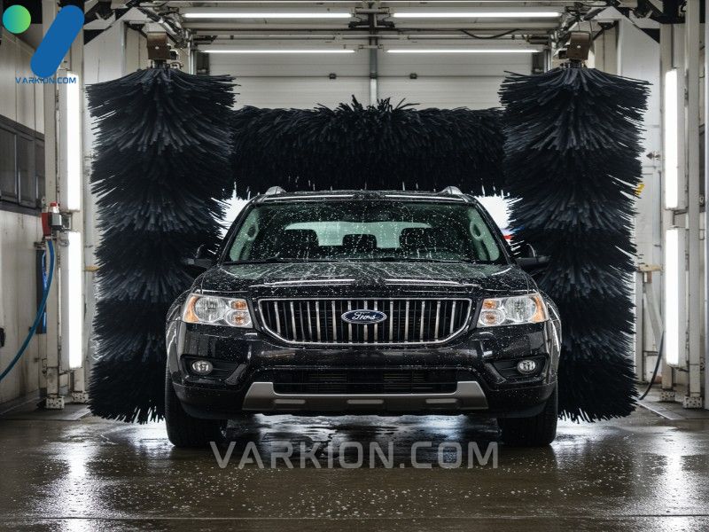 modern-brightly-lit-car-wash-tunnel-cleaning-a-dark-suv-with-soft-cloth-brushes