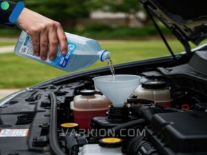 pouring-windshield-washer-fluid-into-car-reservoir-with-a-funnel