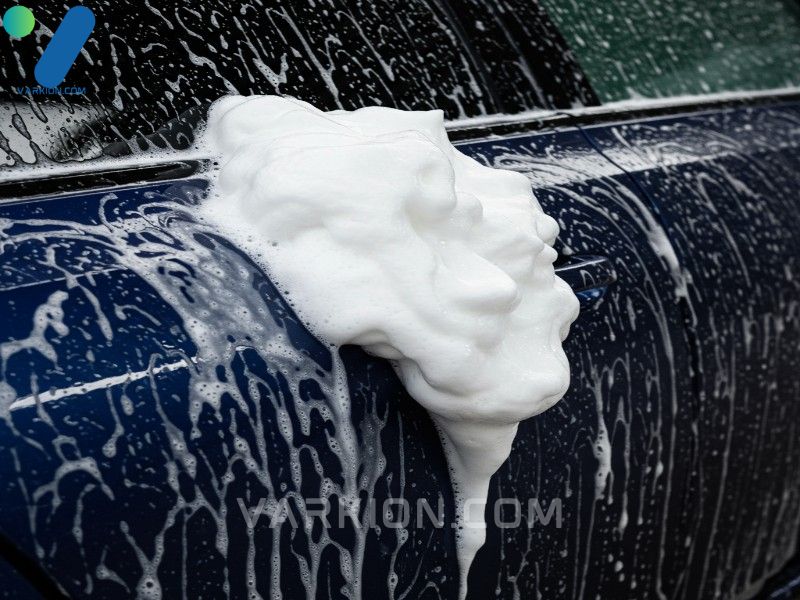 rich-thick-suds-created-by-the-best-car-wash-soap-clinging-to-a-dark-blue-vehicle-showing-effective-lubricity