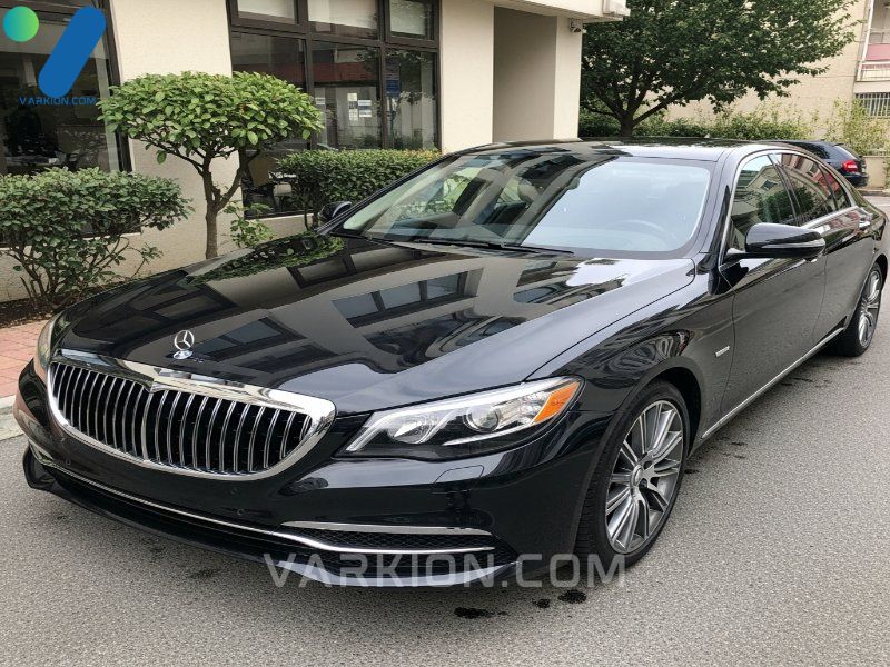 stunning-reflection-on-a-luxury-sedan-after-receiving-the-ultimate-protection-auto-detailing-package-showcasing-the-high-gloss-finish