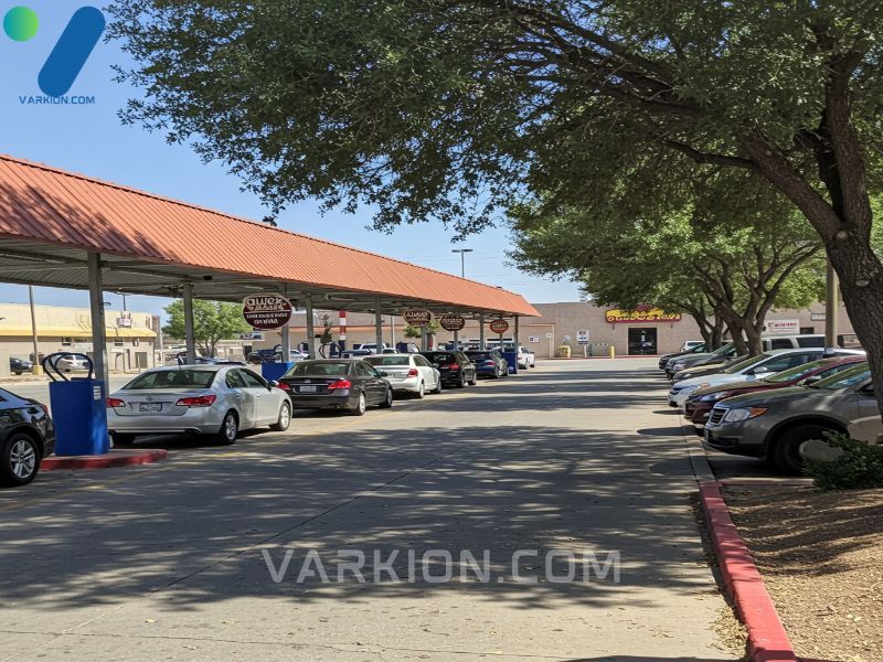 sunny-wide-angle-view-of-quick-quack-car-wash-in-el-paso-showing-multiple-lanes-of-waiting-cars