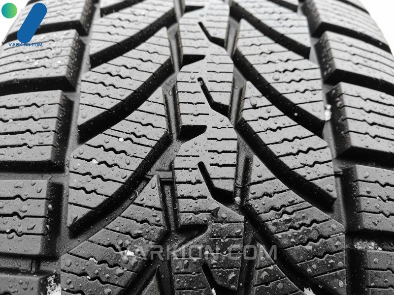 tire-tread-close-up-showing-deep-sipes-and-wide-grooves-for-maximum-snow-and-water-traction