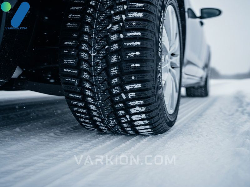 vehicle-confidently-driving-on-ice-with-visible-michelin-winter-tires-tread-gripping-the-surface