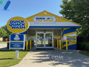 vibrant-quick-quack-car-wash-entrance-featuring-yellow-and-blue-branding-and-the-iconic-duck-mascot