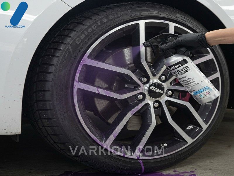 vivid-purple-iron-fallout-remover-reacting-with-brake-dust-on-a-white-car-wheel